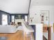 Open-concept living room features a fireplace and flows seamlessly into the kitchen and dining areas at 1139 N Butler Ave, Indianapolis, IN 46219