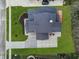 Aerial view of a meticulously maintained home with a dark roof, spacious yard, and inviting outdoor deck at 11640 Ansley Ct, Zionsville, IN 46077