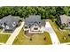 Stunning aerial view of this luxurious home nestled among mature trees and lush greenery at 11640 Ansley Ct, Zionsville, IN 46077