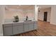 Finished basement featuring a wet bar with gray cabinets and light countertops at 11640 Ansley Ct, Zionsville, IN 46077