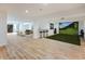Large finished basement featuring a golf simulator, wet bar, and ample seating for leisure and recreation at 11640 Ansley Ct, Zionsville, IN 46077