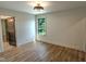 Bright bedroom featuring a window with natural light and wood-look flooring at 11640 Ansley Ct, Zionsville, IN 46077