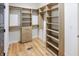 Large walk-in closet features built in shelving and hanging storage, maximizing organization and convenience at 11640 Ansley Ct, Zionsville, IN 46077