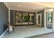 Inviting covered patio with sliding glass doors and access to the backyard at 11640 Ansley Ct, Zionsville, IN 46077