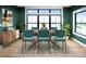 Stylish dining room featuring a modern table, upholstered chairs, and elegant decor with large windows at 11640 Ansley Ct, Zionsville, IN 46077
