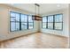 Bright dining area with hardwood floors, large windows, and stylish pendant lighting at 11640 Ansley Ct, Zionsville, IN 46077