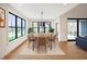 Elegant dining room with modern table, chairs, and a stylish rug, bathed in natural light at 11640 Ansley Ct, Zionsville, IN 46077