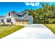 Beautiful home featuring a three-car garage and a well-maintained lawn at 11640 Ansley Ct, Zionsville, IN 46077
