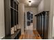 Inviting hallway with built-in bench and storage, plus a view into the modern kitchen at 11640 Ansley Ct, Zionsville, IN 46077