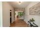 Elegant hallway featuring a stone archway and stairs leading to upper level at 11640 Ansley Ct, Zionsville, IN 46077