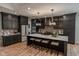 Well-equipped kitchen featuring custom cabinets, stone backsplash, and a large island for prepping meals at 11640 Ansley Ct, Zionsville, IN 46077