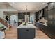 Spacious kitchen with large center island, granite countertops, and state-of-the-art appliances for gourmet cooking at 11640 Ansley Ct, Zionsville, IN 46077