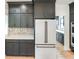 Well-appointed kitchen with dark cabinets, stone backsplash, and stainless steel appliances at 11640 Ansley Ct, Zionsville, IN 46077