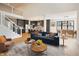 Inviting living room with stylish furniture, an open floor plan, and a modern kitchen at 11640 Ansley Ct, Zionsville, IN 46077