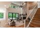 Soaring ceilings and a stone fireplace create a grand living space with an abundance of natural light at 11640 Ansley Ct, Zionsville, IN 46077