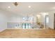 Bright upstairs loft features an open floor plan, hardwood floors, and modern railing design at 11640 Ansley Ct, Zionsville, IN 46077