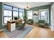 Bright office space with large windows, modern desk, comfortable seating, and stylish decor at 11640 Ansley Ct, Zionsville, IN 46077