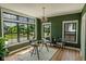 Bright office features large windows offering scenic views, complemented by stylish decor and natural light at 11640 Ansley Ct, Zionsville, IN 46077