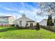 Lush backyard featuring a wooden deck and a vibrant green volleyball net, offering a recreational space at 12030 Driftstone Dr, Fishers, IN 46037