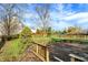 A spacious backyard with a wooden deck and volleyball net set up, perfect for outdoor activities and entertaining at 12030 Driftstone Dr, Fishers, IN 46037