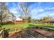Expansive backyard featuring a wooden deck, large grassy area, and a volleyball net for outdoor recreation at 12030 Driftstone Dr, Fishers, IN 46037
