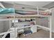 A loft bed with a built-in desk, ideal for a student or creative, offering a space-saving and functional design at 12030 Driftstone Dr, Fishers, IN 46037