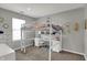 Modern bedroom featuring a loft bed with a built-in desk and ample storage, creating a functional and stylish space at 12030 Driftstone Dr, Fishers, IN 46037
