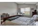 Comfortable bedroom with neutral tones and a large window for ample natural light at 12030 Driftstone Dr, Fishers, IN 46037