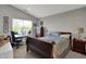 Comfortable bedroom with neutral tones and a large window for ample natural light at 12030 Driftstone Dr, Fishers, IN 46037