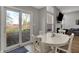 Cozy breakfast nook area with sliding glass doors to the backyard and a fireplace at 12030 Driftstone Dr, Fishers, IN 46037