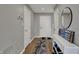 Bright entryway with hardwood floors, storage, and neutral paint, leading into other areas of the home at 12030 Driftstone Dr, Fishers, IN 46037