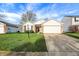 Charming single-Gathering home featuring a well-maintained lawn, a two-car garage and a mix of brick and siding at 12030 Driftstone Dr, Fishers, IN 46037