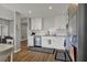 Modern kitchen boasts white cabinetry, stainless steel appliances, and an open layout for easy cooking and entertaining at 12030 Driftstone Dr, Fishers, IN 46037