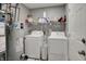 Laundry room featuring a washer, dryer, and utility shelving at 12030 Driftstone Dr, Fishers, IN 46037