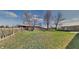 Large fenced backyard with mature trees and grass lawn at 12334 Buckley Blvd, Indianapolis, IN 46229