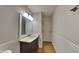 Bathroom featuring a wood vanity with white counter, and panel molding detail at 12334 Buckley Blvd, Indianapolis, IN 46229