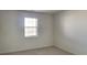 Cozy bedroom featuring carpet, a window letting in light, and ample wall space at 12334 Buckley Blvd, Indianapolis, IN 46229