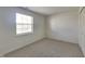 Bright bedroom with a window, closet, and neutral carpet at 12334 Buckley Blvd, Indianapolis, IN 46229