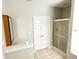 Clean bathroom with a shower and linen closet at 1238 Passage Way, Plainfield, IN 46168