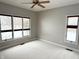 Neutral carpeted bedroom with multiple windows and view to snowy landscape at 1238 Passage Way, Plainfield, IN 46168