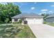 Beautiful brick home with a two-car garage and a well-manicured lawn showcasing lovely curb appeal at 1238 Passage Way, Plainfield, IN 46168