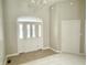 Welcoming foyer features a chandelier and decorative front door allowing for natural light at 1238 Passage Way, Plainfield, IN 46168