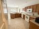 Bright eat-in kitchen with wood cabinets, neutral countertops, and stainless steel appliances at 1238 Passage Way, Plainfield, IN 46168