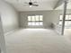 Expansive living room boasting neutral walls, carpeted flooring, and large windows for natural light at 1238 Passage Way, Plainfield, IN 46168