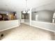 Open-concept living room with new floors, recessed lighting, and an elegant chandelier at 1238 Passage Way, Plainfield, IN 46168