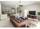 Comfortable living room showcasing stylish decor, a ceiling fan, and an open floor plan at 1238 Passage Way, Plainfield, IN 46168