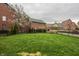 Expansive green backyard with a black metal fence surrounding the property at 12813 Chapel Square St, Carmel, IN 46032