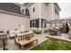 Beautiful backyard featuring outdoor seating, a pergola, and a well-maintained lawn perfect for relaxation and entertainment at 12813 Chapel Square St, Carmel, IN 46032
