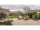 Lush green lawn bordered by black fencing with beautiful homes beyond, showcasing the community's serene setting at 12813 Chapel Square St, Carmel, IN 46032