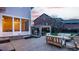 Inviting backyard patio with seating areas, a grill under a pergola, and access to the screened-in porch at 12813 Chapel Square St, Carmel, IN 46032